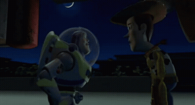 Buzz Lightyear And Woody From Toy Story Are Standing Next To Each Other At Night GIF