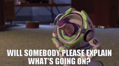 Buzz Lightyear From Toy Story Is Sitting On The Floor With The Words Will Somebody Please Explain What 'S Going On . GIF