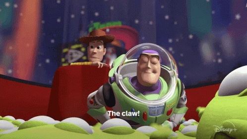 Buzz Lightyear From Toy Story Says The Claw While Woody Watches GIF