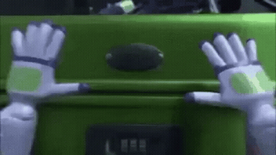 Buzz Lightyear Hands Reaching Toward Green Suitcase GIF