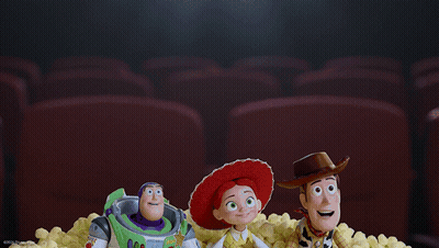 Buzz Lightyear Jessie And Woody From Toy Story Are Sitting In A Pile Of Popcorn GIF