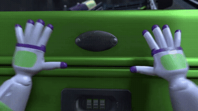 Buzz Lightyear Reaching Into Green Suitcase GIF