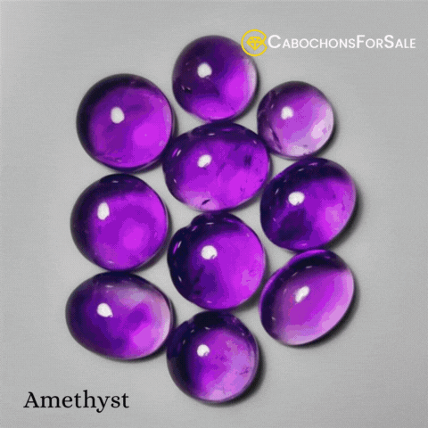 Cabochons For Sale Amethyst Is Displayed On A Grey Background GIF