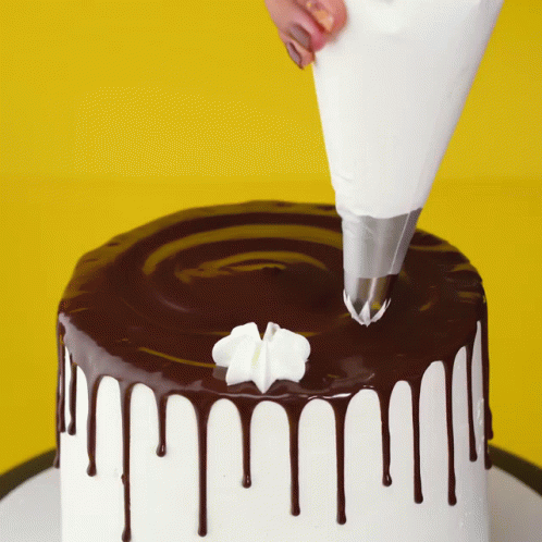 Cake With Chocolate Icing And Whipped Cream GIF