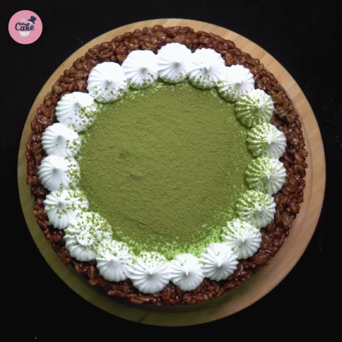 Cake With Whipped Cream And Green Powder GIF