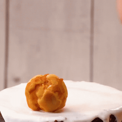 Cake With White Frosting And Caramel Pieces GIF
