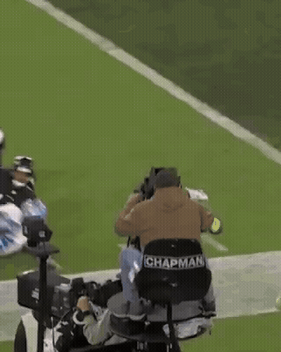 Cameraman Sitting On Football Field GIF