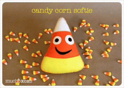 Candy Corn Softie Surrounded By Candy Corn GIF