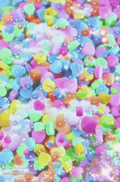 Candy Hearts Floating In Water With Gina Watermark GIF