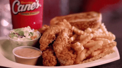 Cane's Soda Next To Fried Chicken And French Fries GIF