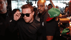 Canelo Álvarez Taking Off Sunglass Walking With Security GIF