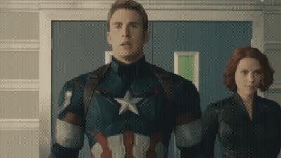 Captain America And Black Widow Are Standing Next To Each Other In A Hallway GIF