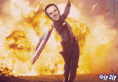 Captain America Holding Shield In Front Of Explosion GIF