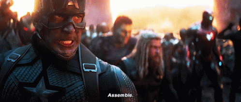 Captain America Is Standing In Front Of A Crowd And Says Assemble GIF