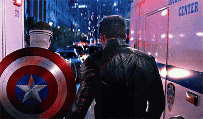 Captain America Shield Man Beside Leather Jacket Man GIF