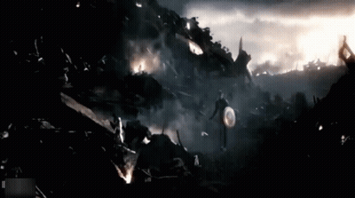 Captain America Walking Through Destroyed City With Shield GIF