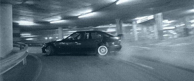 Car Drifting In Parking Garage With Number 7 GIF