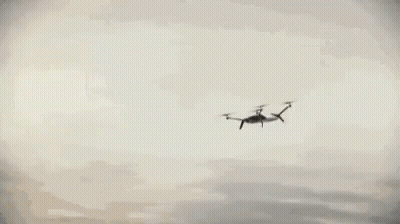 Car Driving Along Curvy Ocean Road GIF