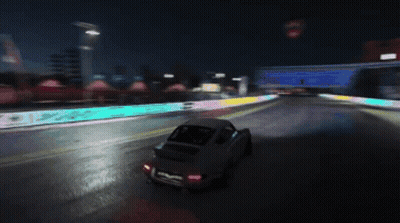 Car Driving At Night With No Trucks Sign GIF