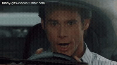 Car Driving Down City Street GIF
