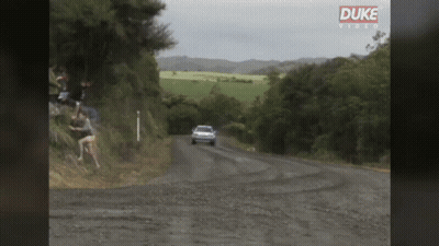Car Driving Down Dirt Road GIF