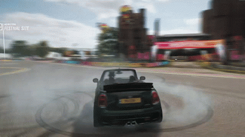 Car Driving Down Road With Festival Site Sign GIF