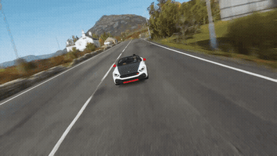 Car Driving Down Road With Mountain GIF