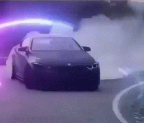 Car Driving Down Road With Purple Light GIF