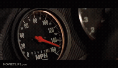 Car Driving Down Street At Night With Blue Lights GIF