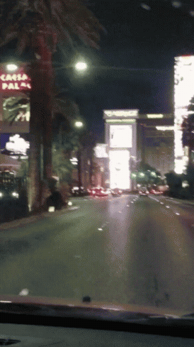 Car Driving Down Street With Casa Palma Sign GIF