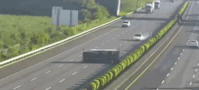Car Driving Next To Overturned Semi Truck GIF