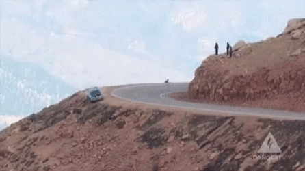 Car Driving Off Cliff And Rolling Around GIF
