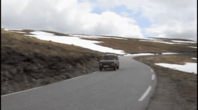 Car Driving On Road With Snowy Hills GIF