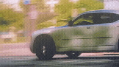 Car Driving On Street With Trees GIF
