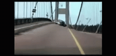Car Driving Over Bridge In Blurry Video GIF