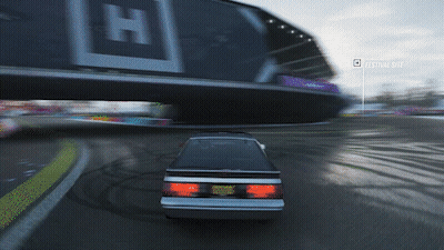 Car Driving Past Billboard Festival Site GIF