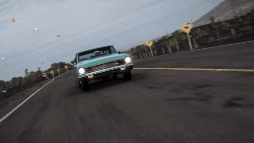 Car Driving Past Yellow Right Sign GIF