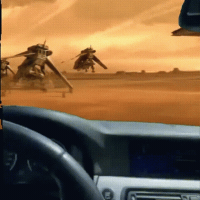 Car Driving Through Desert With Helicopter GIF