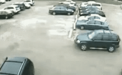 Car Driving Through Parking Lot GIF