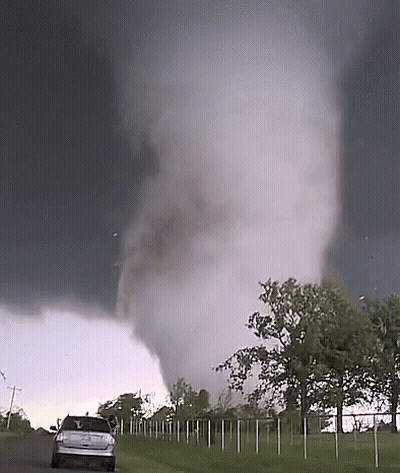 Car Driving Toward Tornado GIF