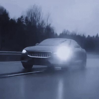 Car Driving Wet Road At Night With Headlights GIF