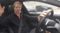 Car Driving While Waving GIF