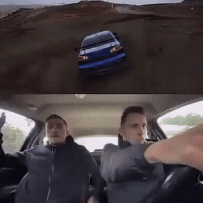 Car Flying Through Air In Front Of Building GIF