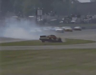Car Flying Through Air On Race Track GIF