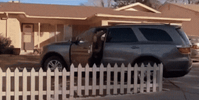 Car Parked In Front Of House With Door Open GIF