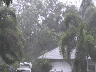 Car Parked In Front Of House With Paradise Sign GIF