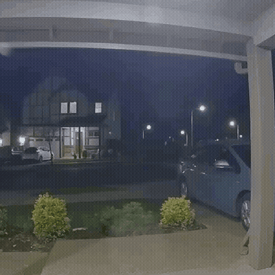 Car Parked Under Covered Porch At Night GIF