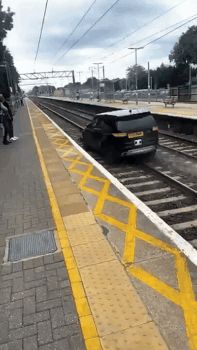 Car Stuck On Train Track At Station GIF