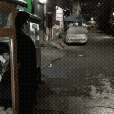 Car With Cover Parked On Road At Night GIF