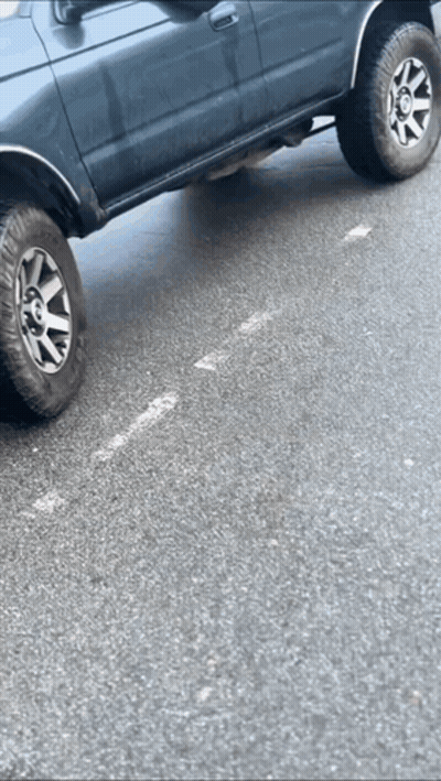 Car With Flat Tire Parked GIF